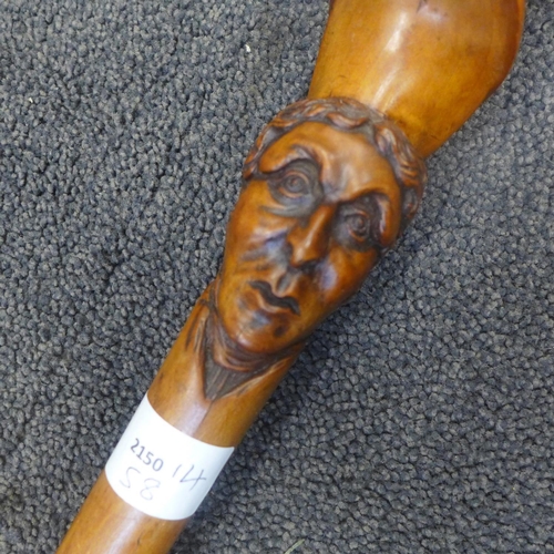 816 - A 19th Century carved fruitwood walking stick with two opposing carved heads, possibly French noblem... 