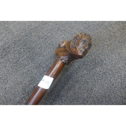 817 - A 19th Century Duke of Wellington 'The Iron Duke' walking stick with carved oak handle and spiral tw... 