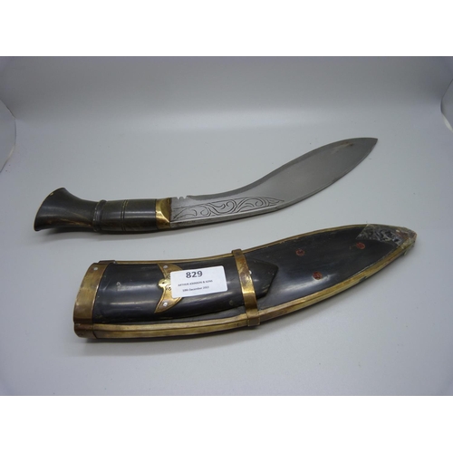 832 - A kukri, knife and a box of knives