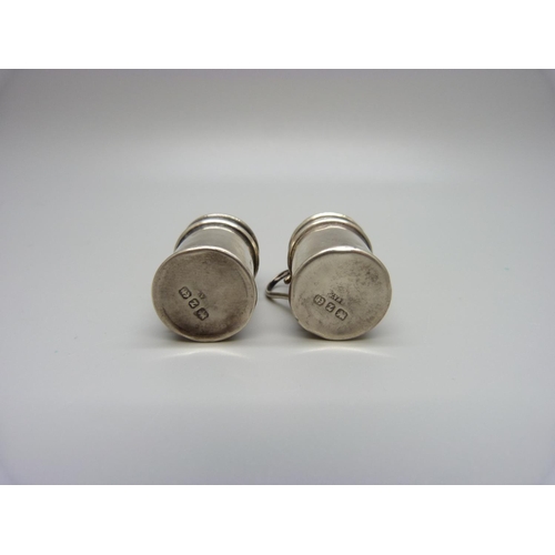 852 - A pair of silver miniature salt and pepper shakers, 12.9g, a/f, both dented