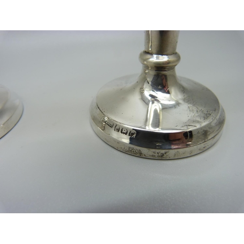 855 - A pair of silver candlesticks with weighted bases, Birmingham 1923, 13.5cm, 220g