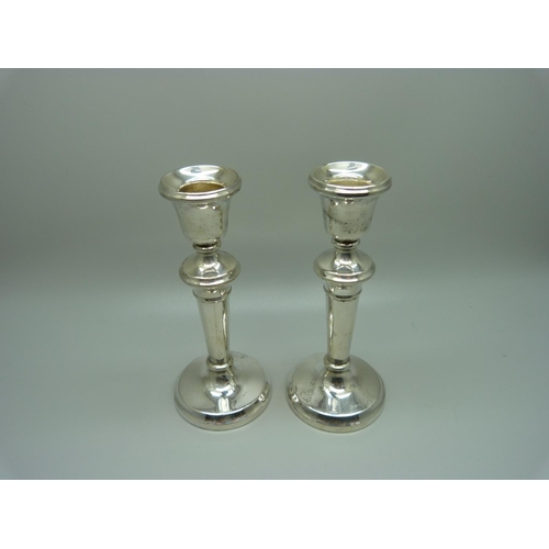 855 - A pair of silver candlesticks with weighted bases, Birmingham 1923, 13.5cm, 220g