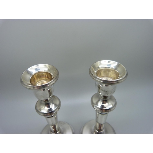 855 - A pair of silver candlesticks with weighted bases, Birmingham 1923, 13.5cm, 220g