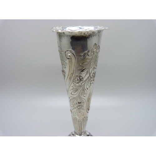 859 - An embossed silver vase with weighted base, London 1888, William Comyns maker, 15.3cm 169g