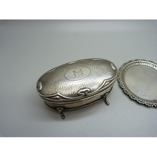 860 - An Art Nouveau silver box with monogram and two silver pin trays, 95g