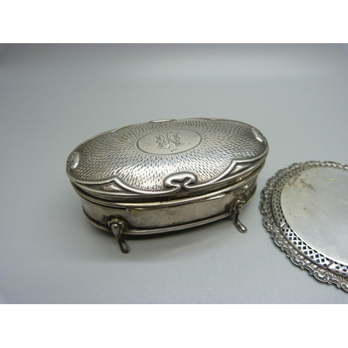 860 - An Art Nouveau silver box with monogram and two silver pin trays, 95g