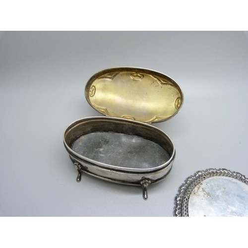 860 - An Art Nouveau silver box with monogram and two silver pin trays, 95g