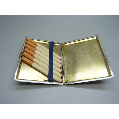 864 - A silver cigarette case, 120g