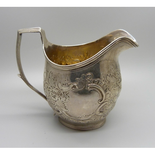 869 - A Georgian silver jug, hallmarks worn, 111g