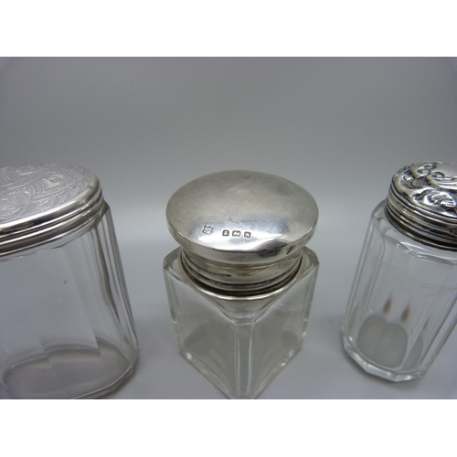 871 - Two silver topped bottles and a silver topped jar