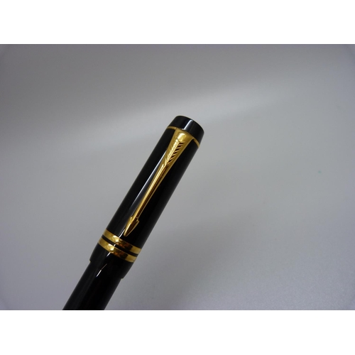 872 - A Parker Duofold fountain pen with 18k nib and two Sheaffer fountain pens