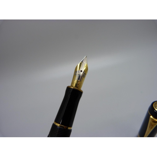 872 - A Parker Duofold fountain pen with 18k nib and two Sheaffer fountain pens