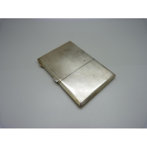 876 - A silver cigarette case with silver gilt interior, 163g