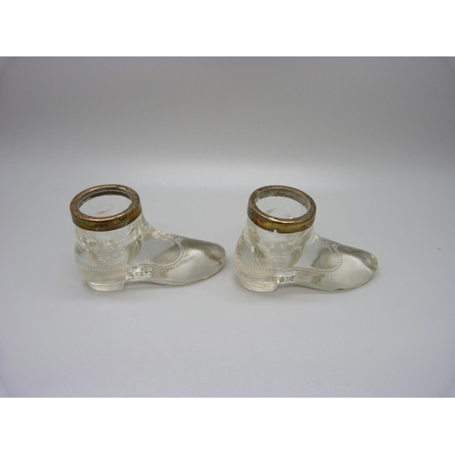 880 - A pair of silver rimmed glass boot salts