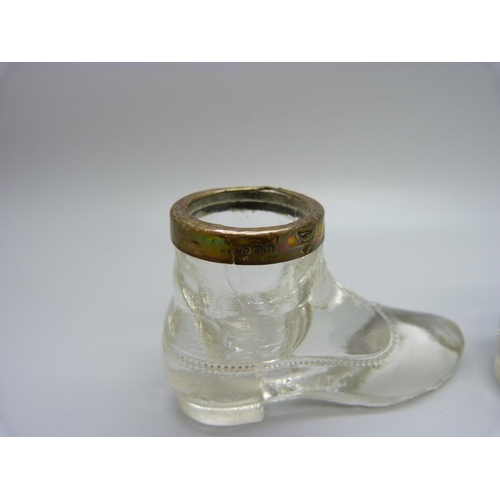 880 - A pair of silver rimmed glass boot salts