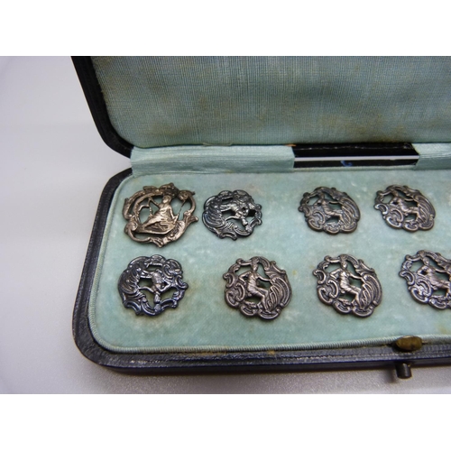 890 - A set of eleven silver buttons, Birmingham 1901, and one similar larger silver buttons, 23g