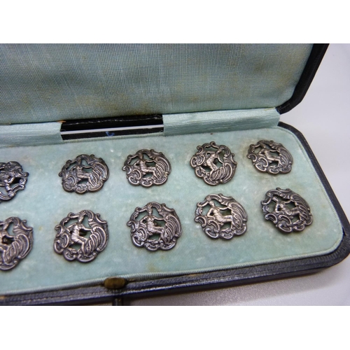 890 - A set of eleven silver buttons, Birmingham 1901, and one similar larger silver buttons, 23g