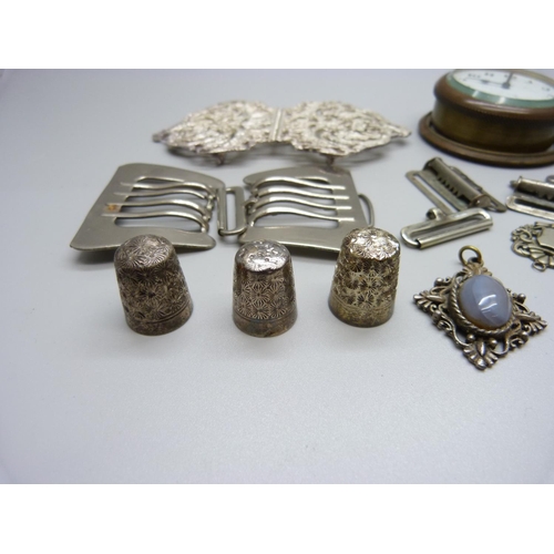 893 - Thimbles, an 8 day clock, buckles, a fob, etc.