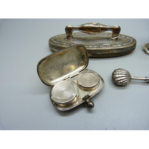 896 - A silver sovereign case, a pepper, nail buffer and skirt clip