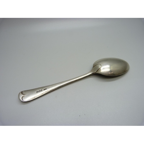 897 - A silver spoon with applied Jersey emblem, 55g