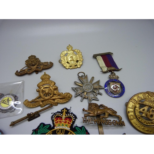 918 - Assorted Regimental badges, two whistles and badges