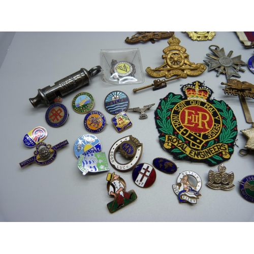 918 - Assorted Regimental badges, two whistles and badges