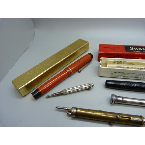 941 - A Swan fountain pen with 14ct gold nib, assorted pens and pencils including silver