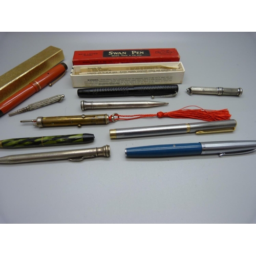 941 - A Swan fountain pen with 14ct gold nib, assorted pens and pencils including silver