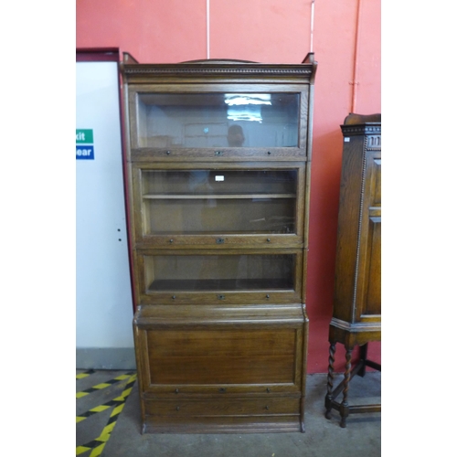 102 - An early 20th Century Lebus oak five tier sectional stacking bookcase, 198cms h, 88cms w, 44cms d