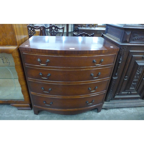 111 - A George III style inlaid mahogany bow front chest of drawers