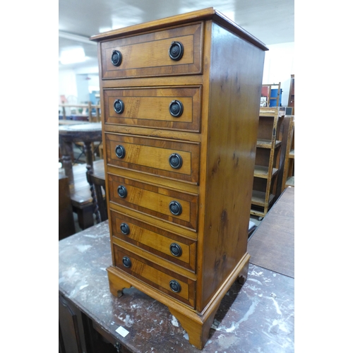 118 - A small yew wood chest of drawers