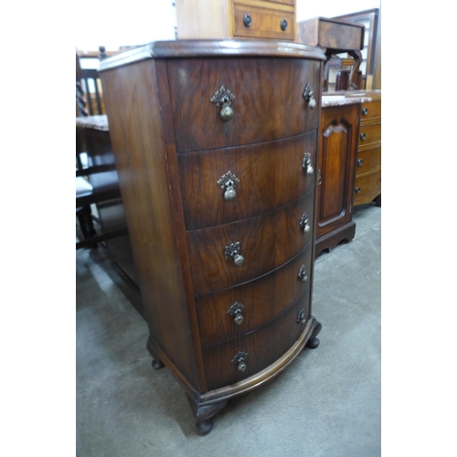 119 - A small walnut chest of drawers