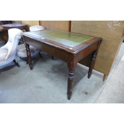 144 - A Victorian mahogany and green leather topped library table