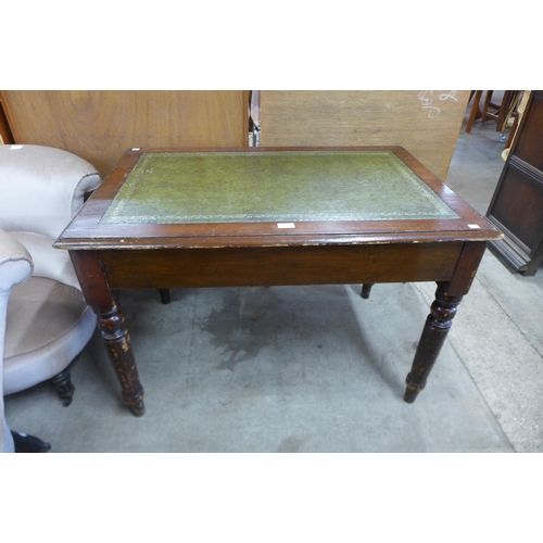 144 - A Victorian mahogany and green leather topped library table