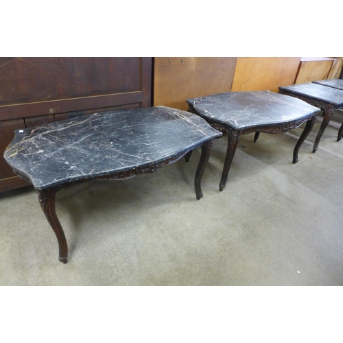 147 - A pair of French style beech and marble topped serpentine coffee tables