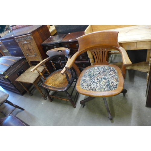 150 - An early 20th Century oak revolving desk chair, an elm and beech smokers bow and one other