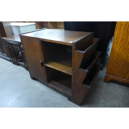 169 - An Art Deco oak cabinet/newspaper stand