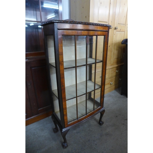 170 - A walnut single door display cabinet