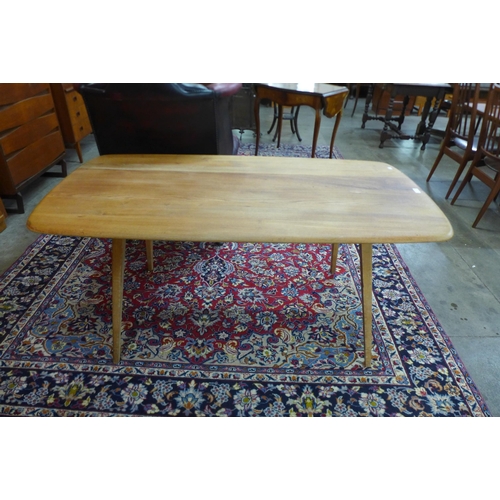 2 - An Ercol elm and beech 382 model plank top dining table