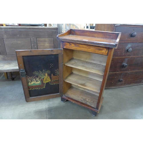 204 - A pine and beech single door cupboard