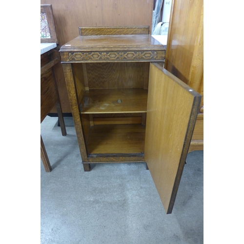 207 - An Edward VII oak and marble topped washstand and an oak pot cupboard