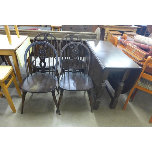 237 - An oak gateleg table and four chairs