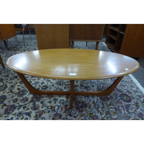 30 - An oval teak coffee table