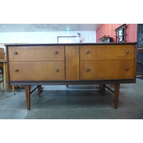 36 - A Homeworthy teak four drawer sideboard