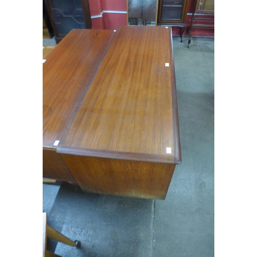 36 - A Homeworthy teak four drawer sideboard