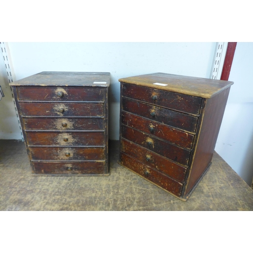 370 - A pair of vintage table top pine watchmakers chests, including large quantity of pocket watch glasse... 