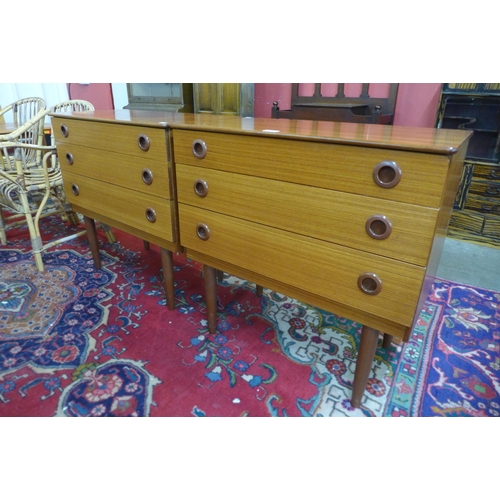 41 - A pair of teak chests of drawers