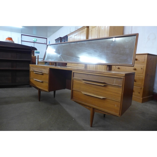 45 - A White & Newton teak dressing table and matching bedside cabinets