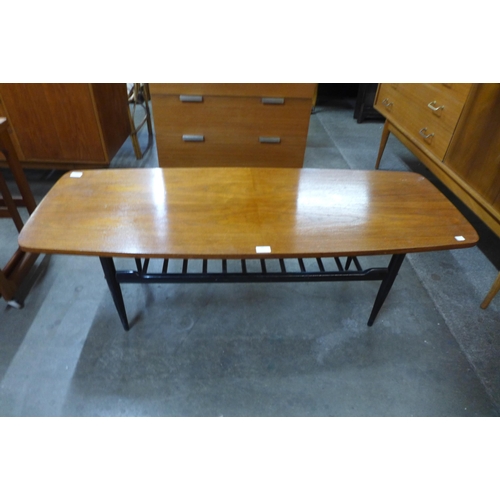 49 - A teak and black painted coffee table