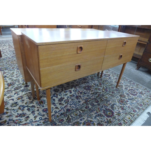 59 - A small teak four drawer sideboard